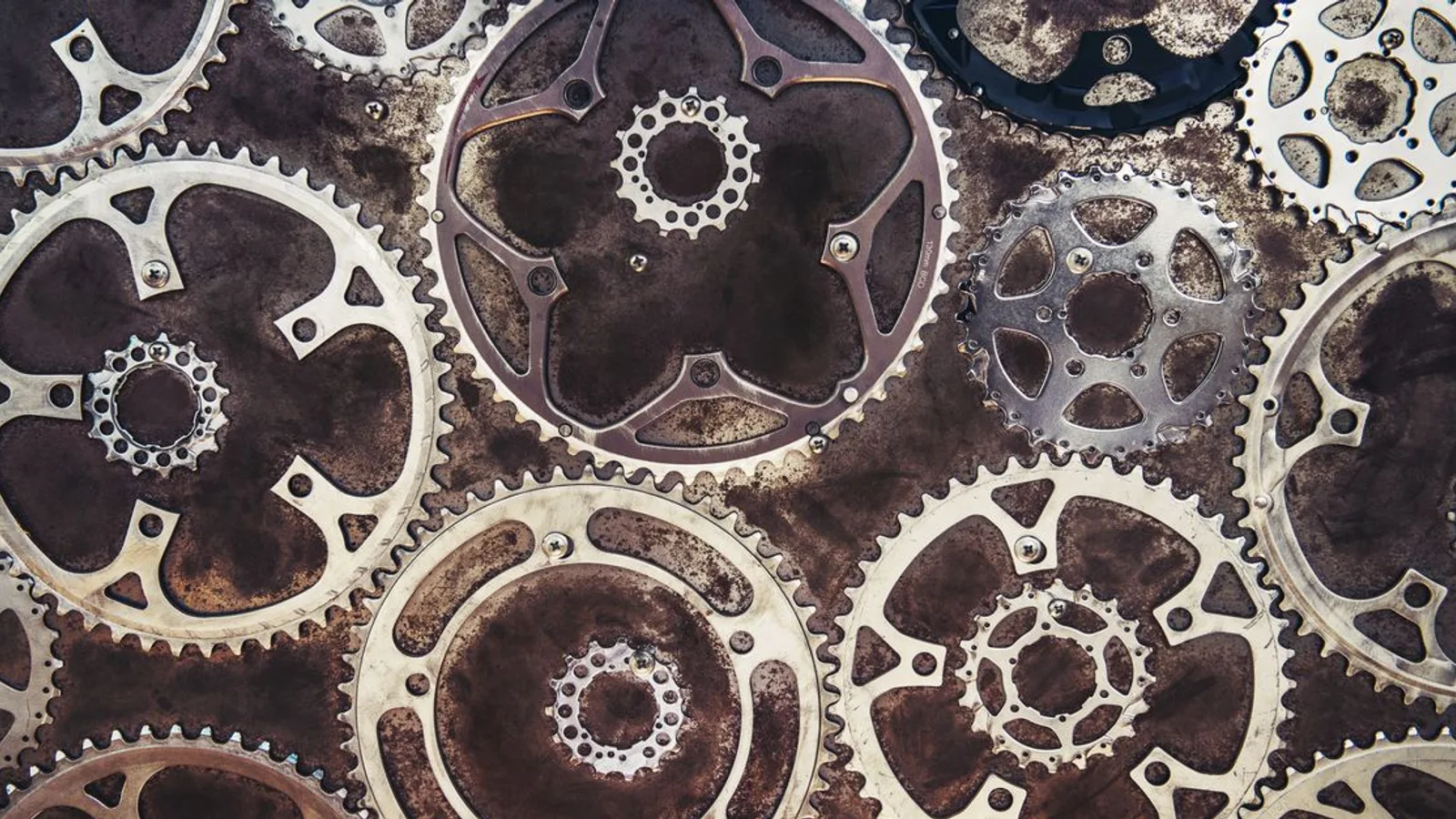 Close-up of interlocking metal gears creating an industrial texture.